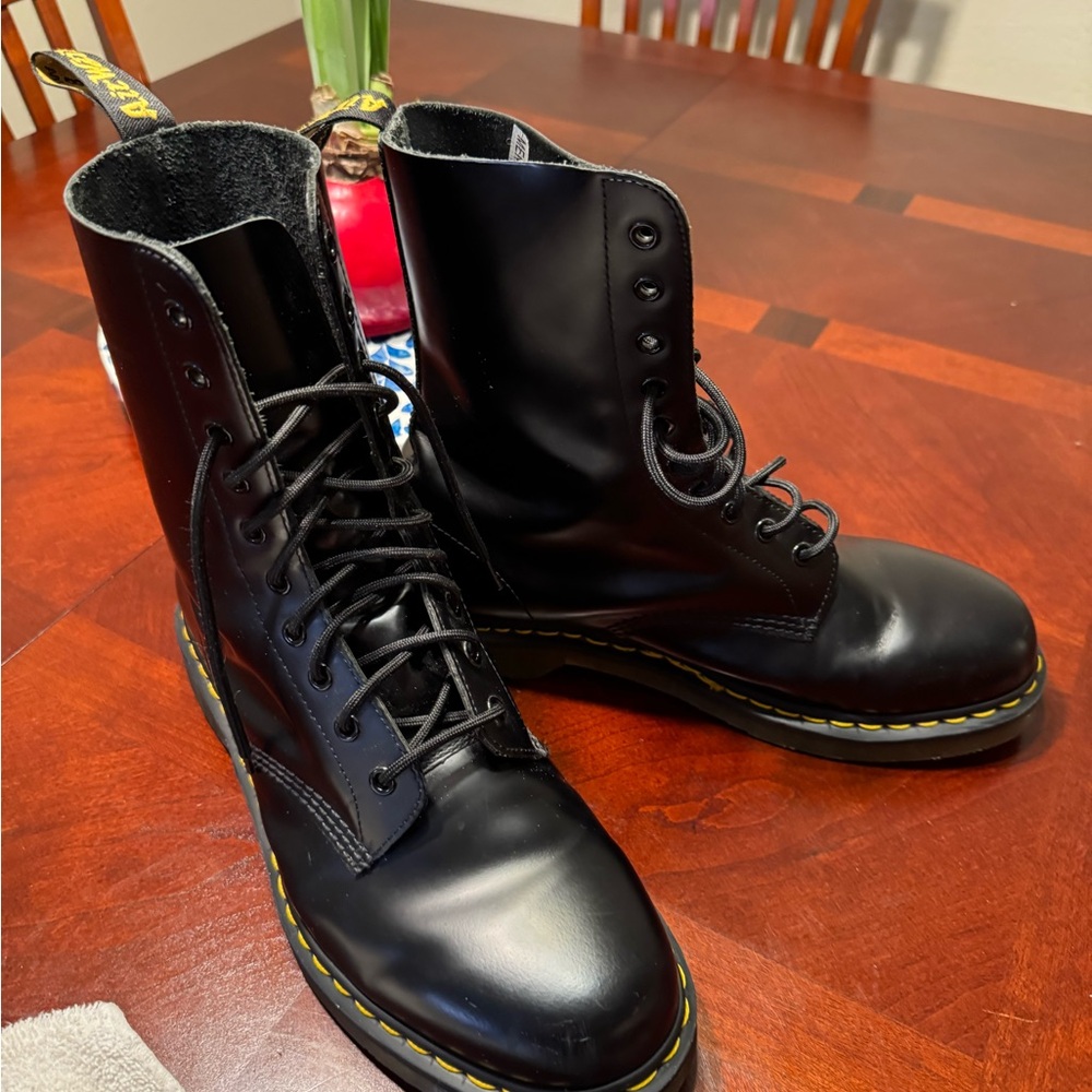 Men’s Doc Martens Black 1460 Style Boots with polished finish and yellow laces.